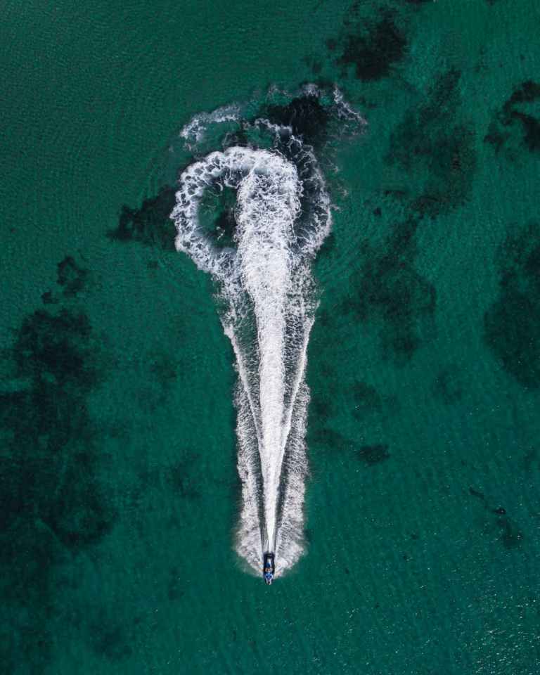 aerial photo of boat on body of water